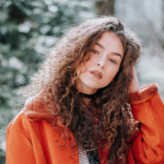 a woman with curly hair