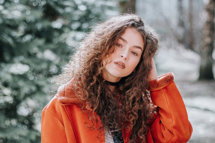 a woman with curly hair